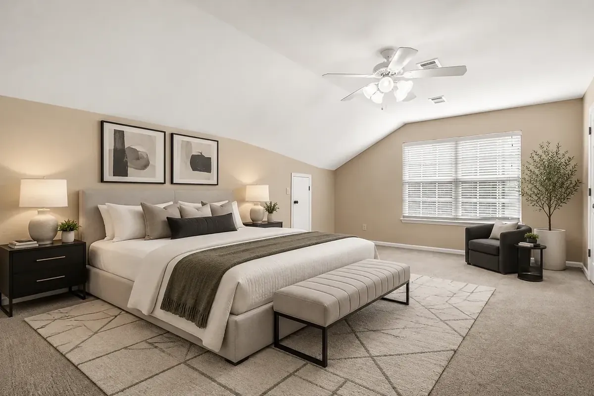 A bedroom, staged in the modern style